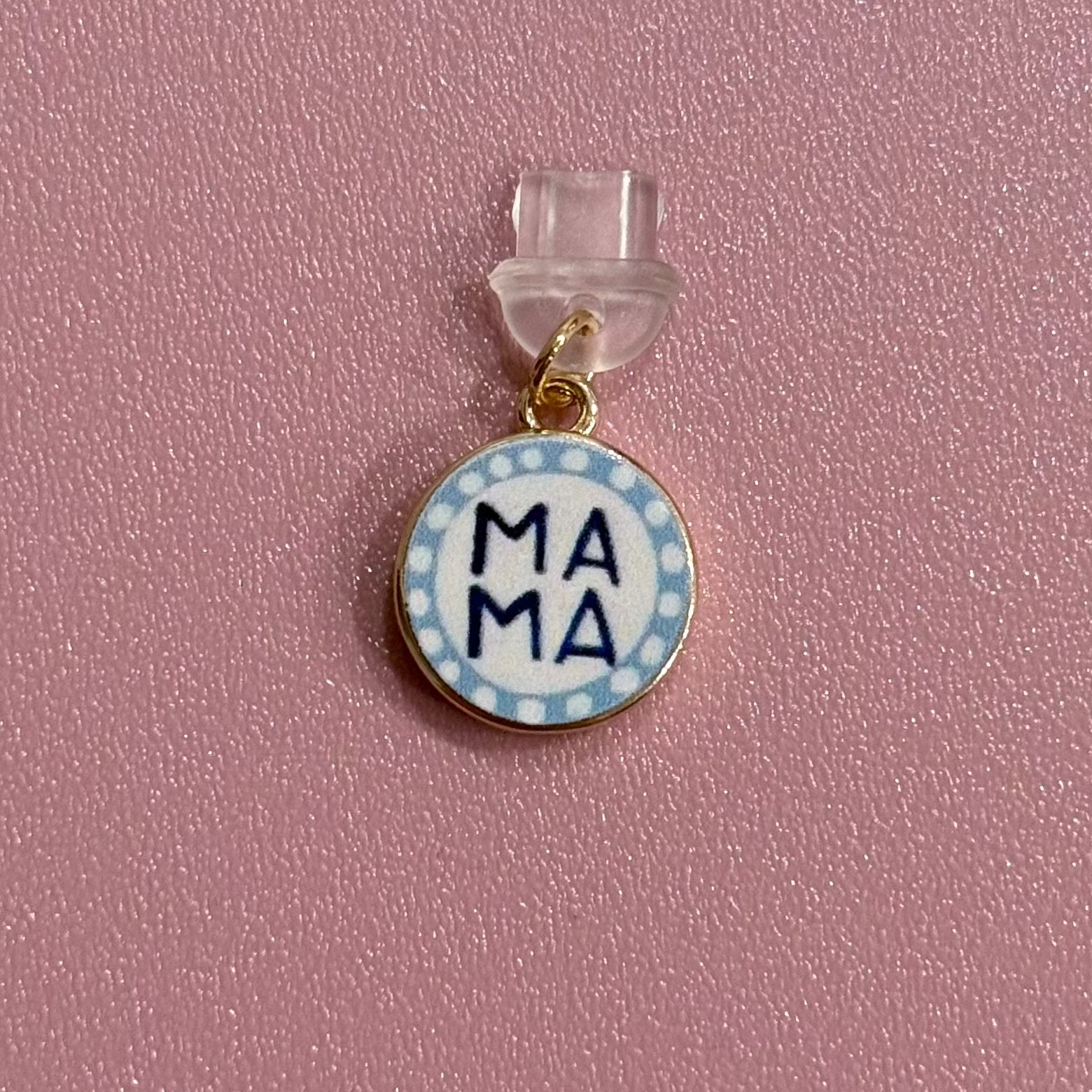 Pendant with 'MAMA' text on a pink background